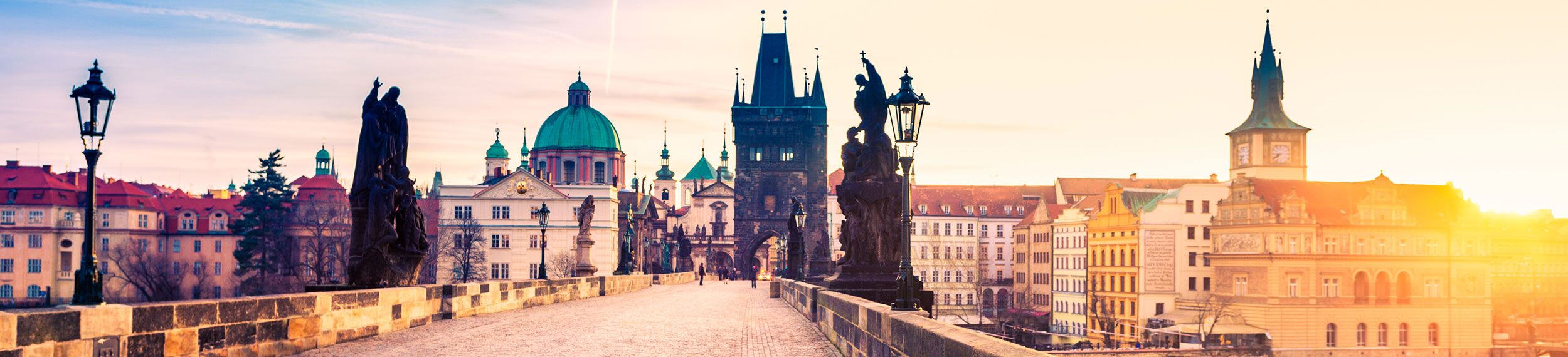 View of Charles Bridge and city skyline in Prague, Czech Republic.