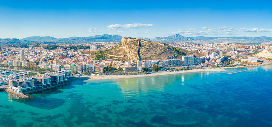 Aerial panoramic view of Alicante, with the Postiguet Beach, port of Alicante, and the Castle of Santa Barbara