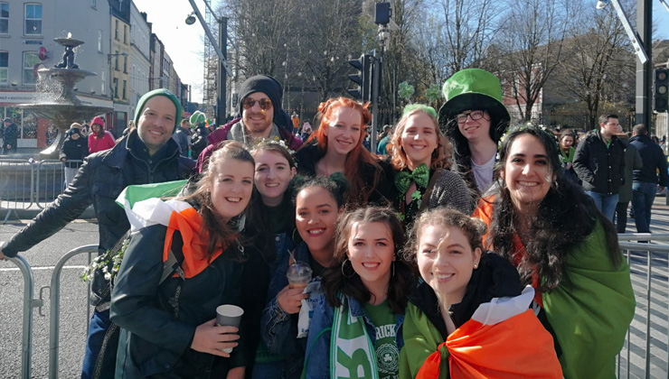 Eleven students smiling for a group shot in Cork, Ireland.