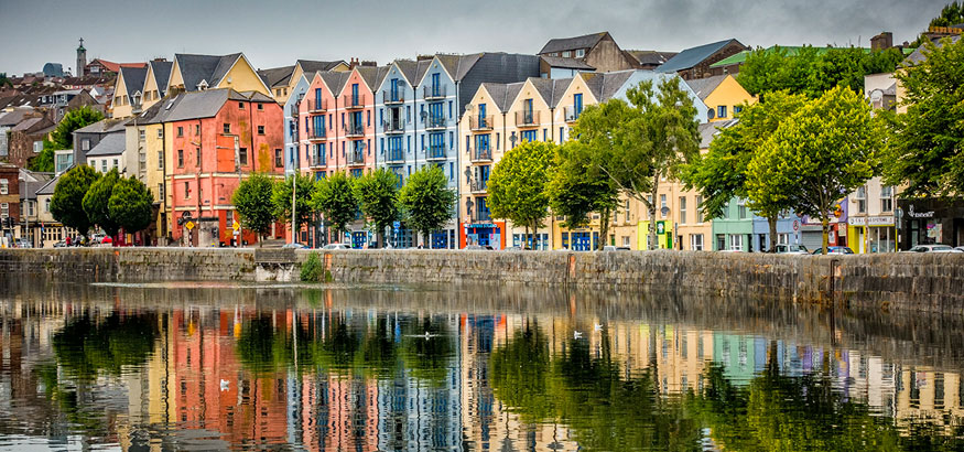 Rows of colorful buildings near the water in Cork, Ireland.