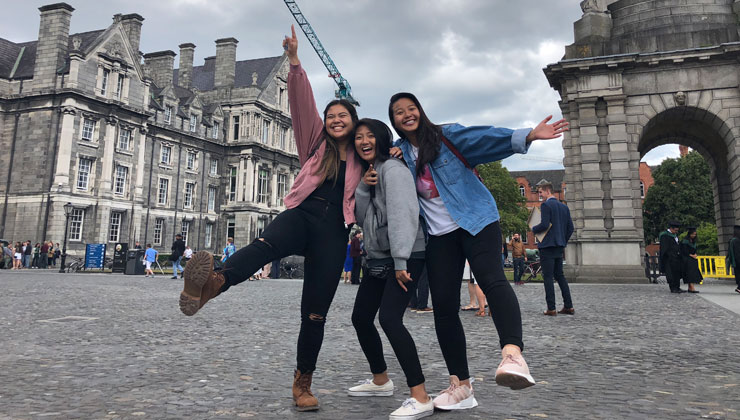 Three students posing for the camera on campus in Dublin ,Ireland.