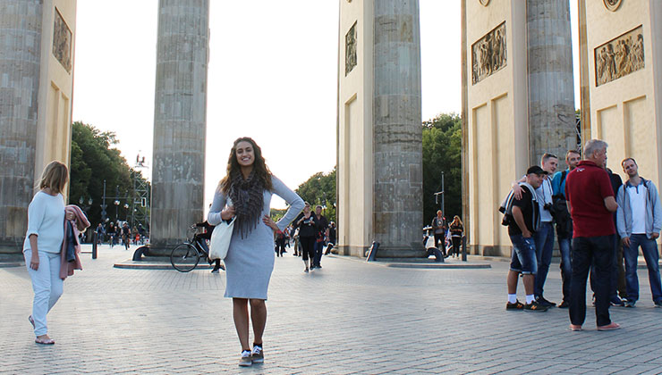 UC Santa Cruz student standing in front of the Brandenburg Gate in Berlin, Germany.