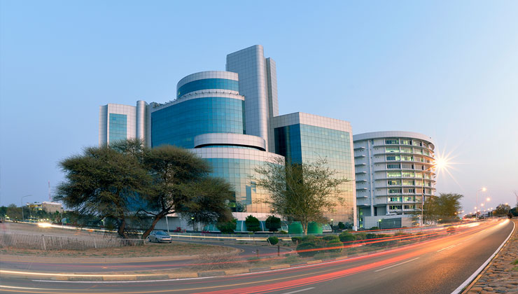 City buildings and busy highway in Gaborone, Botswana.