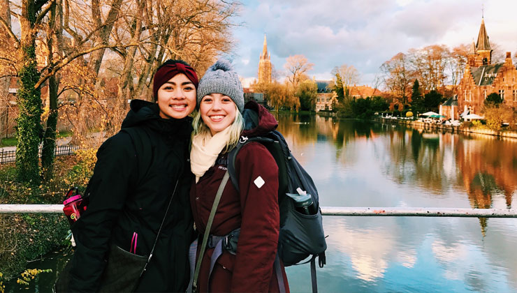 Student and a friend visit Minnewater Lake in Bruges, Belgium. 