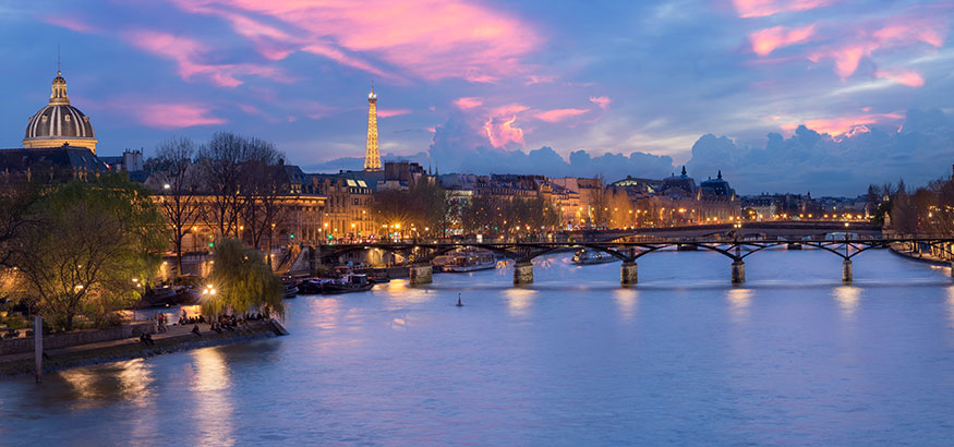 Sunset cityscape view of the Pont des Arts, Paris