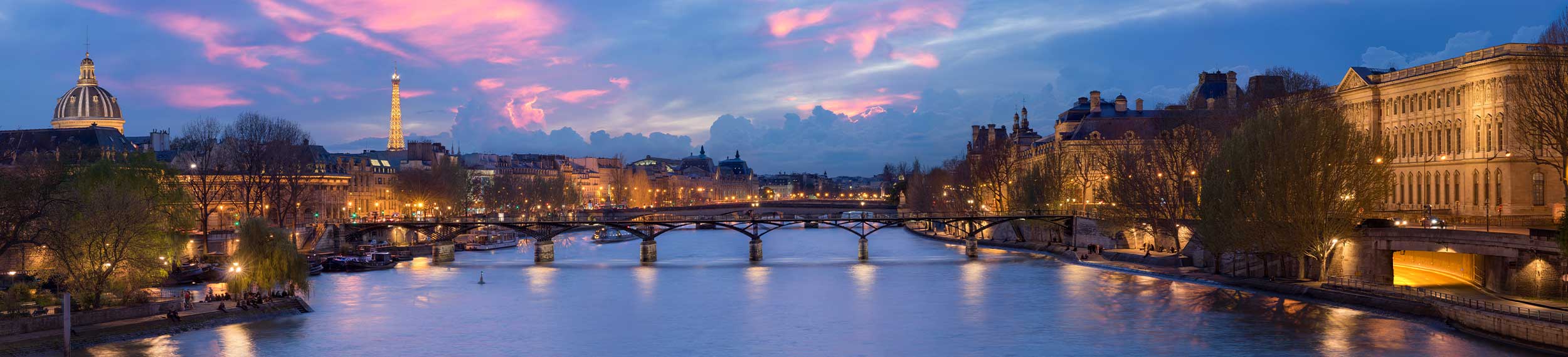 Sunset cityscape view of the Pont des Arts, Paris