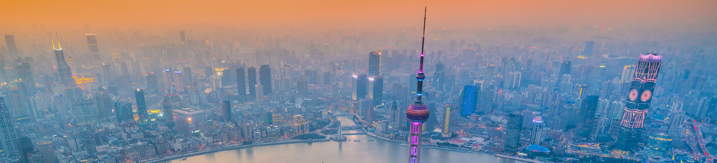 Shanghai city skyline, aerial view of the skyscrapers of Pudong and Huangpu River.