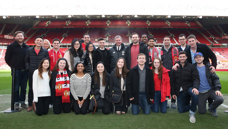 Study abroad students including UCEAP students at a Manchester United game in Manchester, England