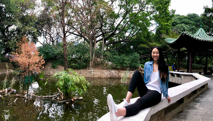 Student kicks back on a bridge in Kowloon Park in Hong Kong.