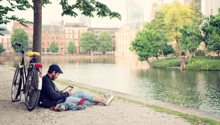 Man sitting near the Hofvijver in The Hague, Netherlands.