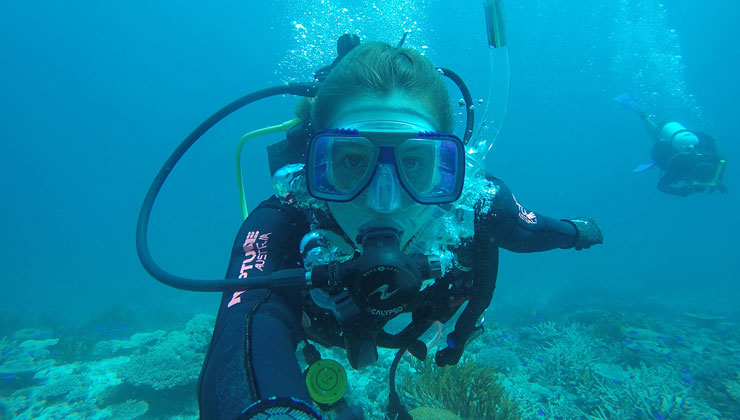 UCEAP student scuba diving in the beautiful water of Queensland, Australia.