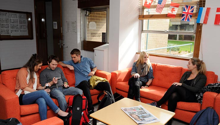 students gather in campus common room 