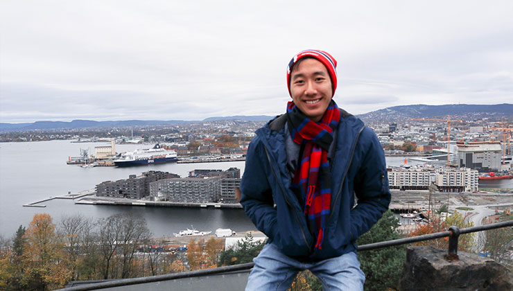 UC Los Angeles student smiles and enjoys the view of the water in Ekeberg, Norway. 