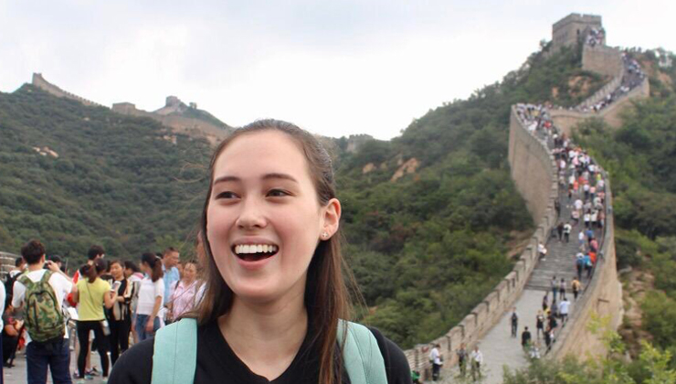 Student takes in the view of the Great Wall of China. 