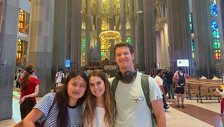 Three friends inside the La Sagrada Familia cathedral in Barcelona