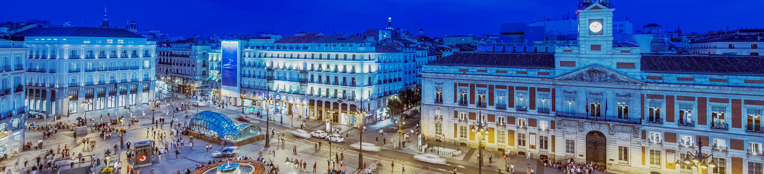 Ornate buildings illuminated at night, Madrid