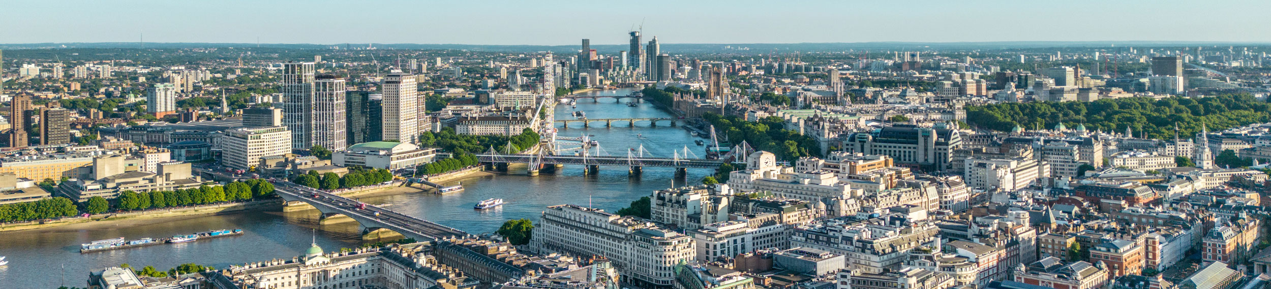 Aerial view of historic London rooftops and skyline and the River Thames