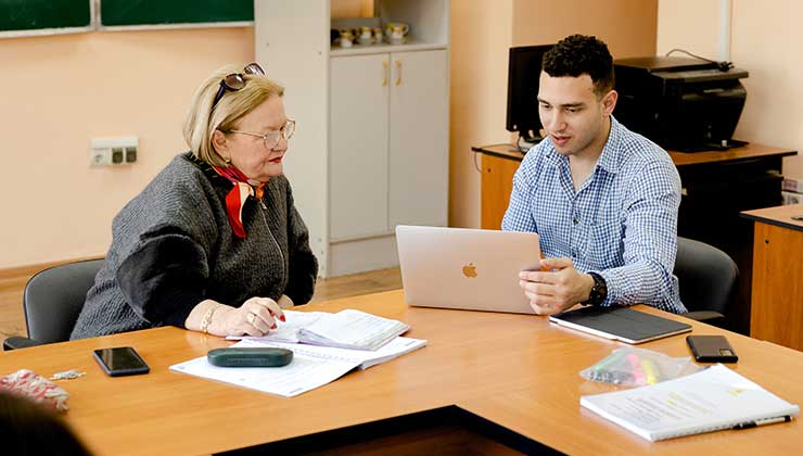 Student in class with advisor at Kazakhstan National University 
