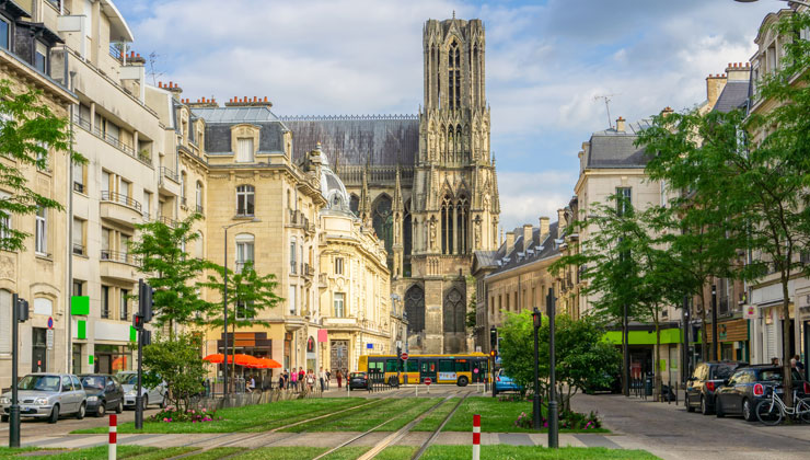 A city shot with a view of Cathédrale Notre-Dame de Reims in Reims, France.