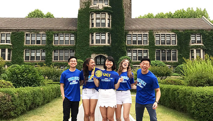 Five students smile for a photo on the Yonsei University campus in Seoul, South Korea. 