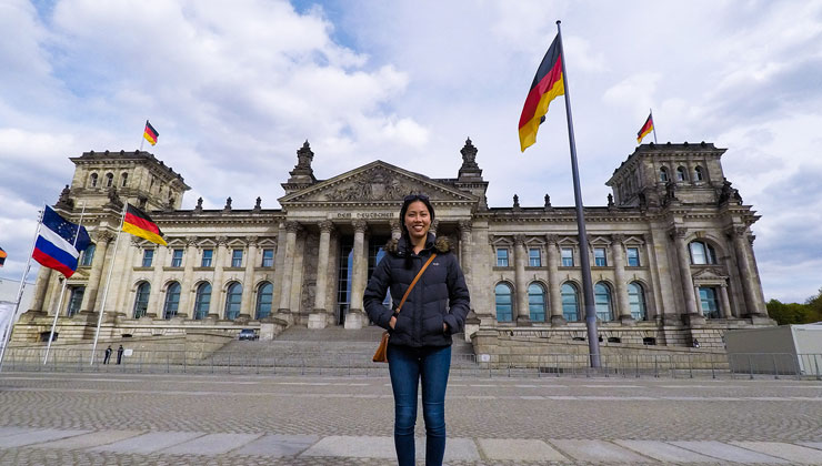 UC Riverside student stands in front of the Reichstag Building in Berlin, Germany.