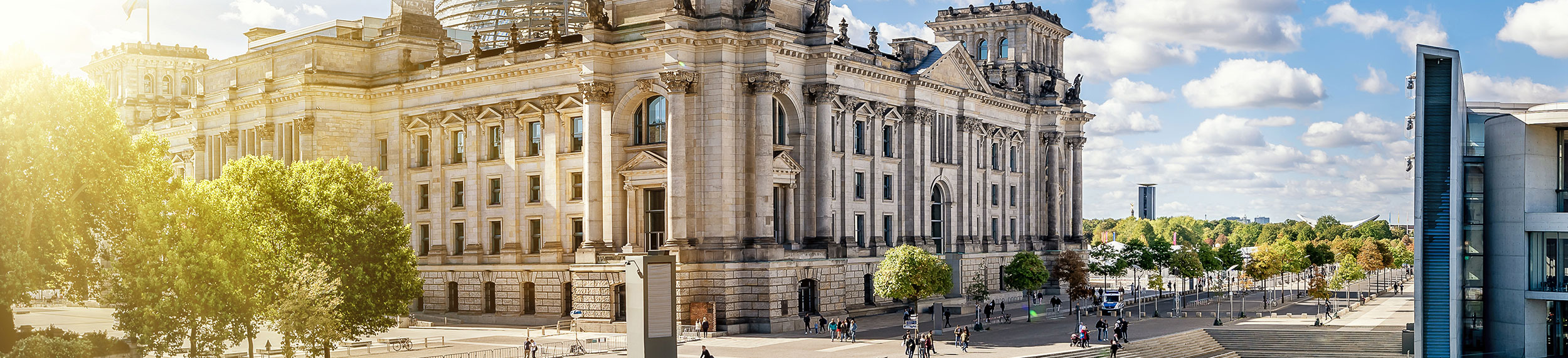 View of the Reichstag building the Spree River on a beautiful summer day in Berlin, Germany.