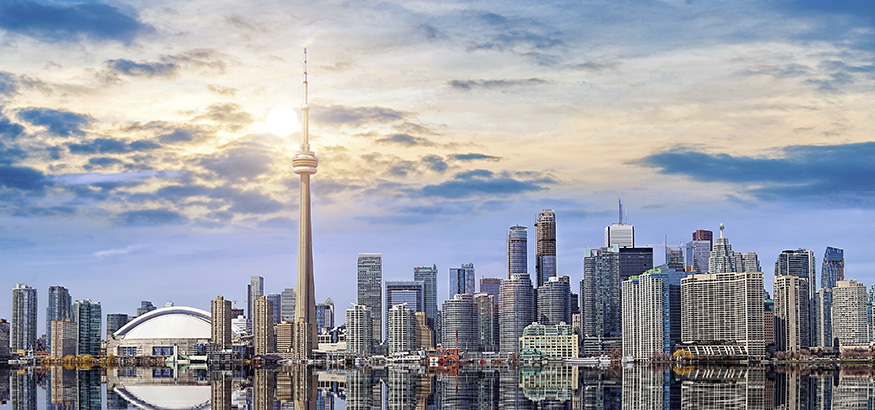 View of the Toronto skyline reflects on the water.