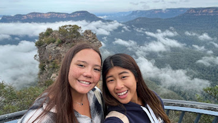 Two students taking a selfie at a vista point in the Blue Mountains, New South Wales. 