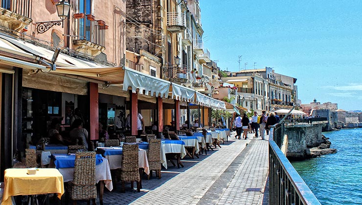 Colorful cafés on the waterfront in Ortygia, Syracuse