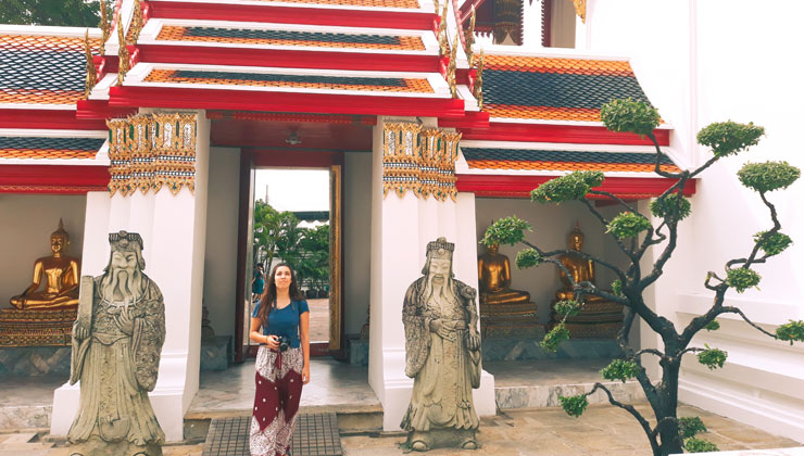 A student walking out of a temple in Bangkok Thailand. 