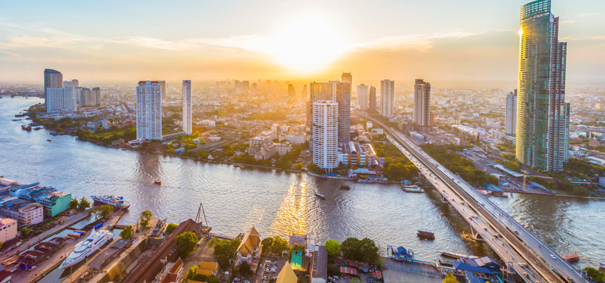 An aerial shot of Chao Phraya River and downtown Bangkok Thailand.