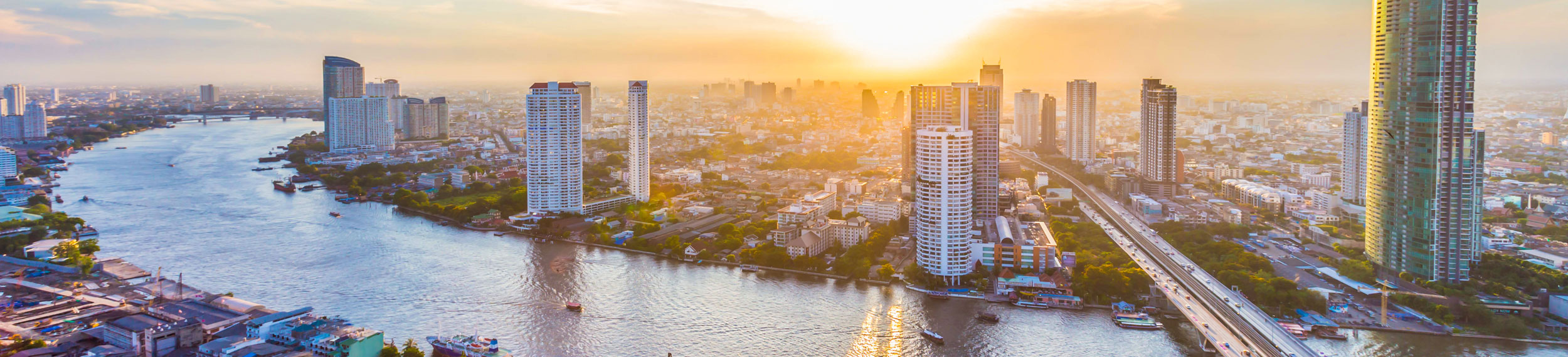 An aerial shot of Chao Phraya River and downtown Bangkok Thailand.