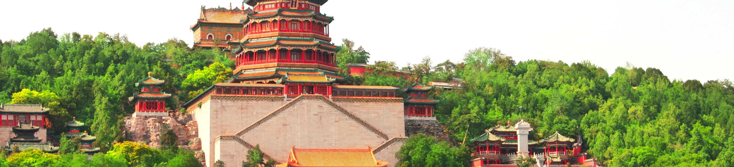 View of Beijing's Summer Palace with lush green trees around the buildings in Beijing China. 