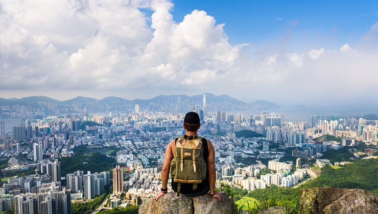 Student enjoying the cityscape view of Hong Kong from Lion Rock. 