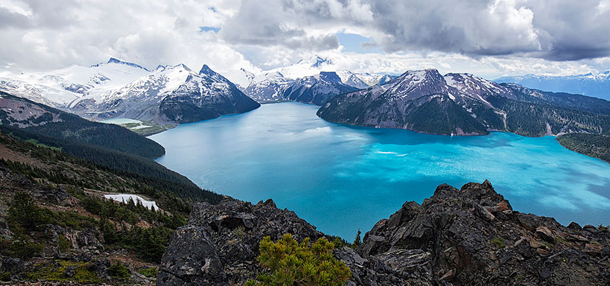 View of mountains and Garibaldi Lake from Panorama Ridge in Squamish, British Columbia, Canada.