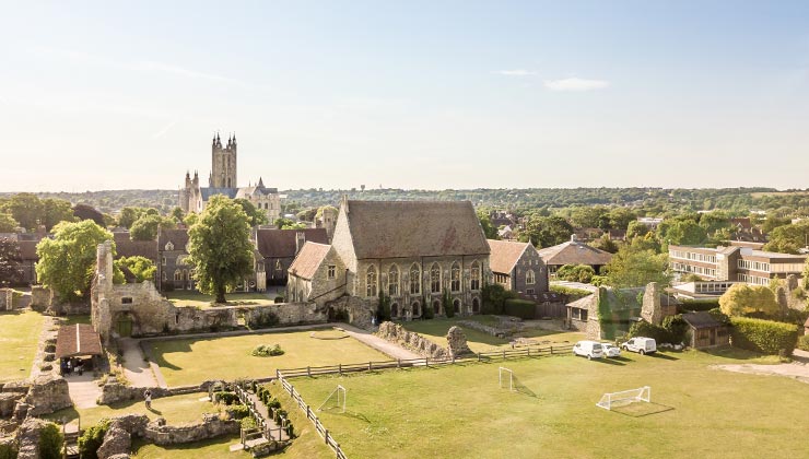 Aerial view of historic buildings and Canterbury cathedral.