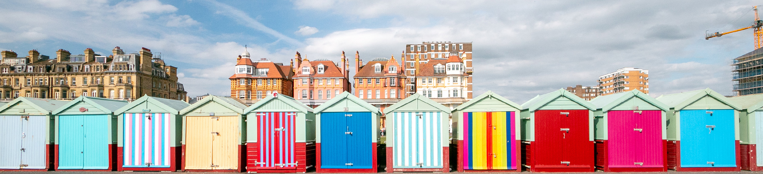 Colorful row of beach huts on in Brighton, Hove, England