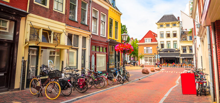 Landscape shot of a traditional old street and colorful buildings in Utrecht, Netherlands. Utrecht, Netherlands