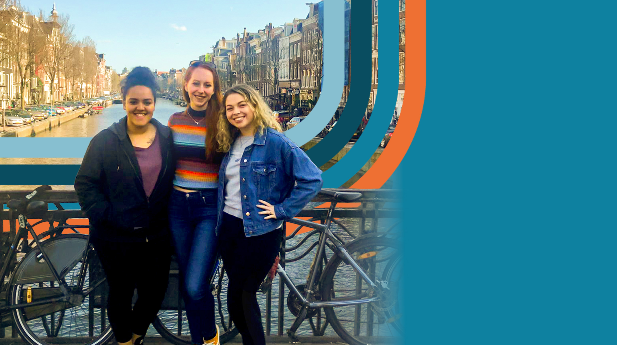 Three students standing on a bridge over a tree lined canal in Amsterdam