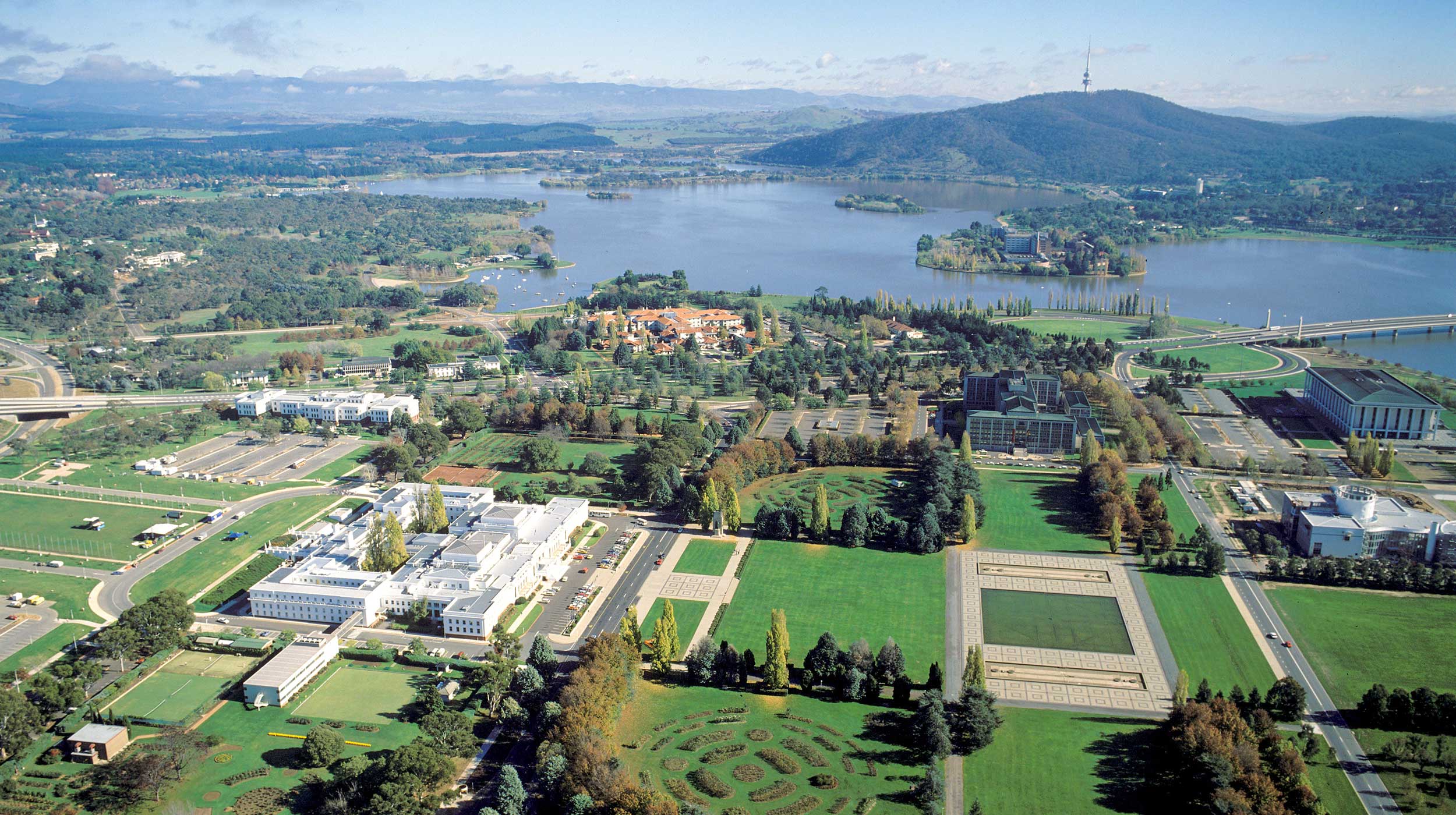 Aerial view of old parliament buildings and Lake Burley Griffin, Canberra, Australia 