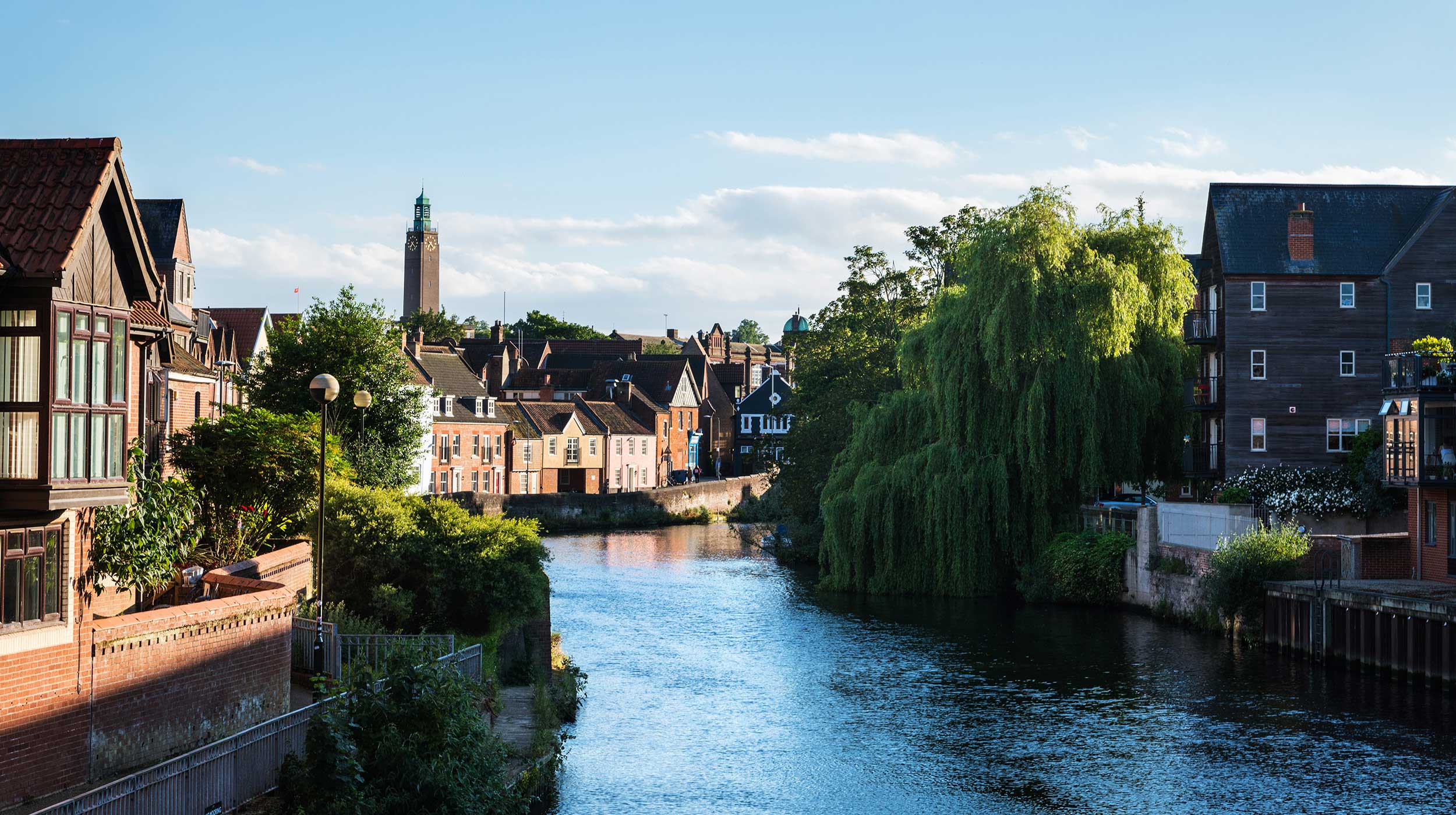 Traditional houses by the river Wensum in Norwich at dusk, Norfolk.