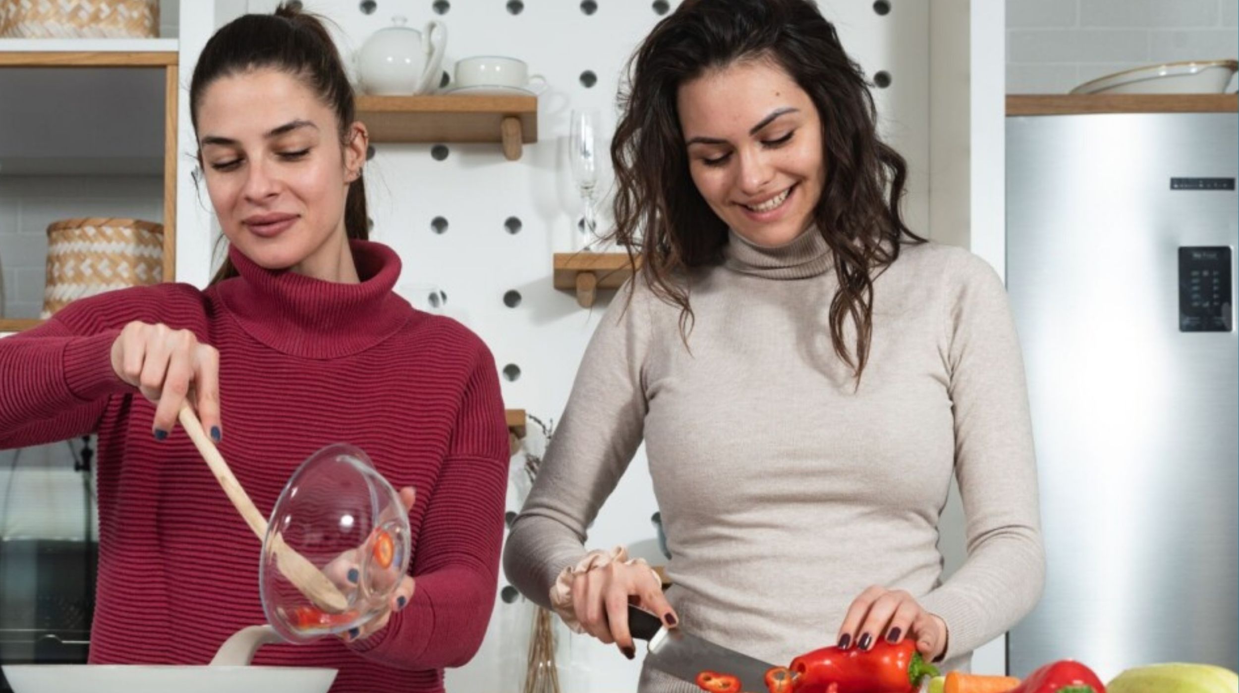 two students cooking at home to save money