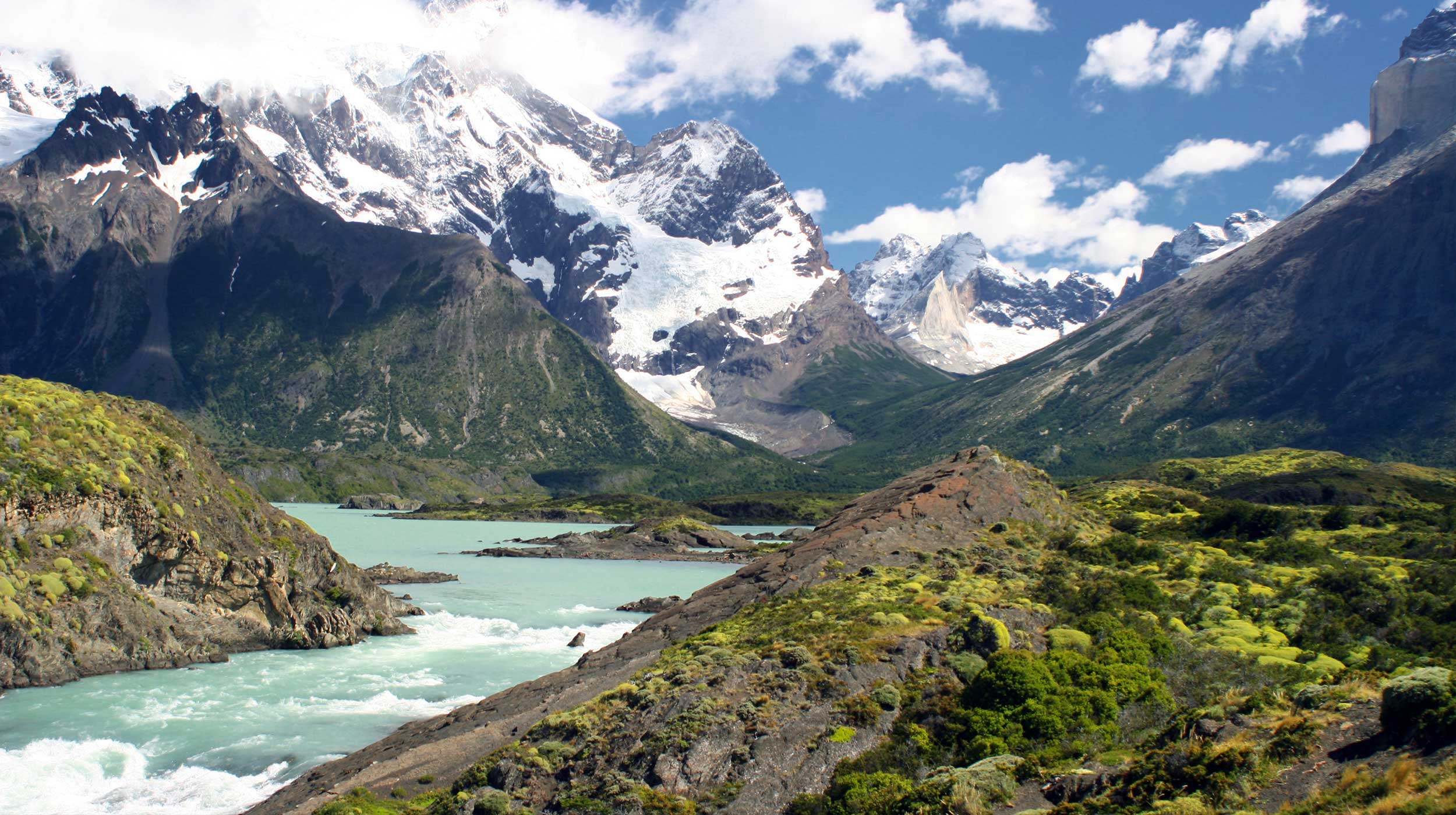 Mountain range, river, and forest in Torres del Paine National Park, Patagonia, Chile
