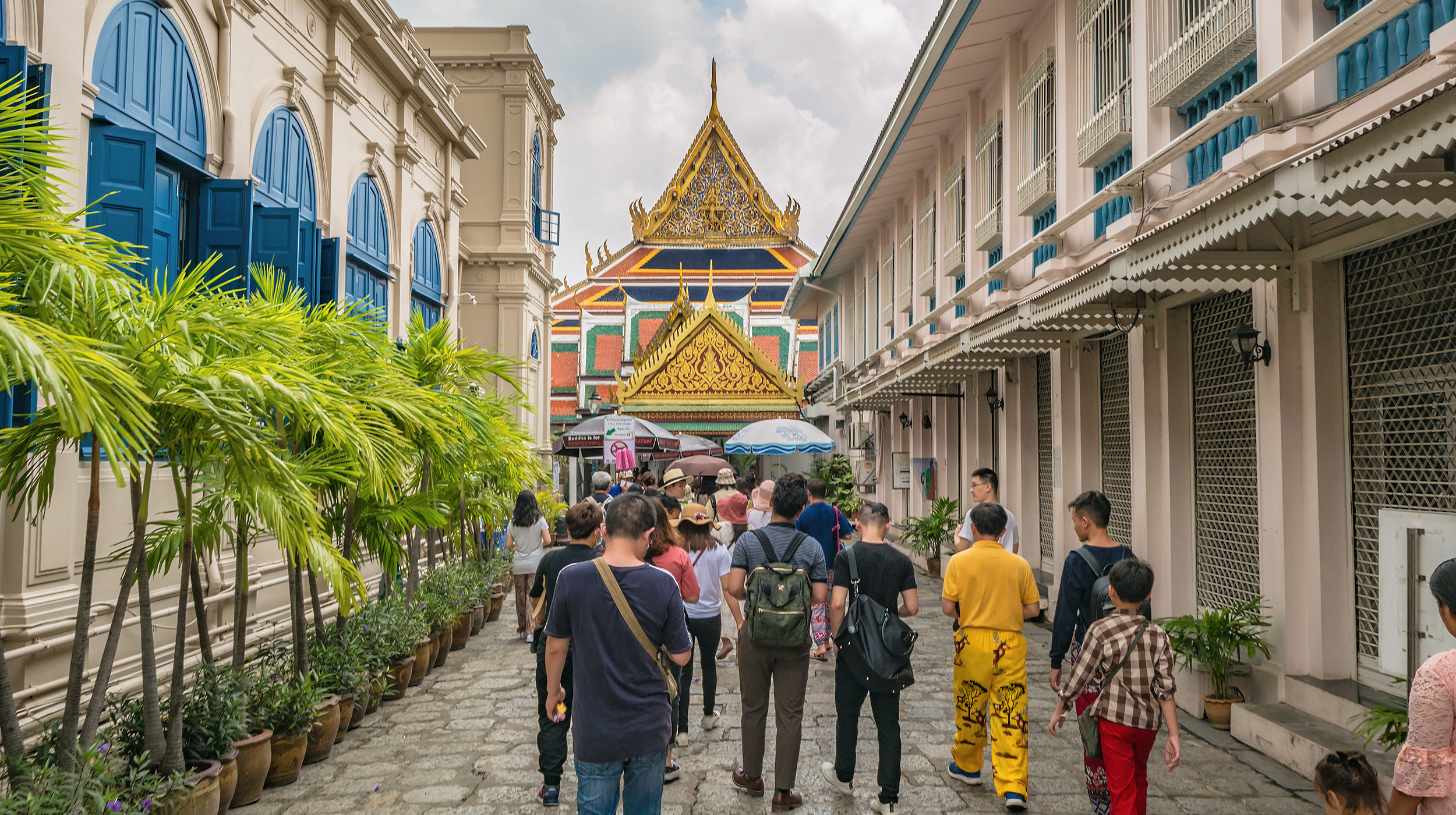 Group of people walking through Thailand on a tour.