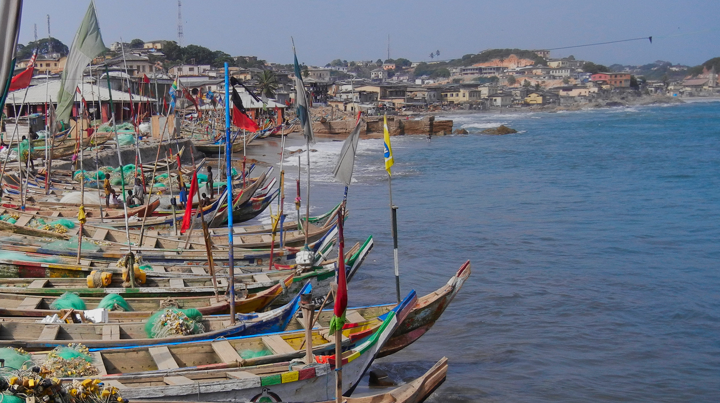 Fishing boats lined up in the harbor of Cape Coast in Ghana