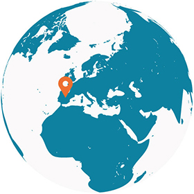 Globe of the world with a geographic pin on Spain