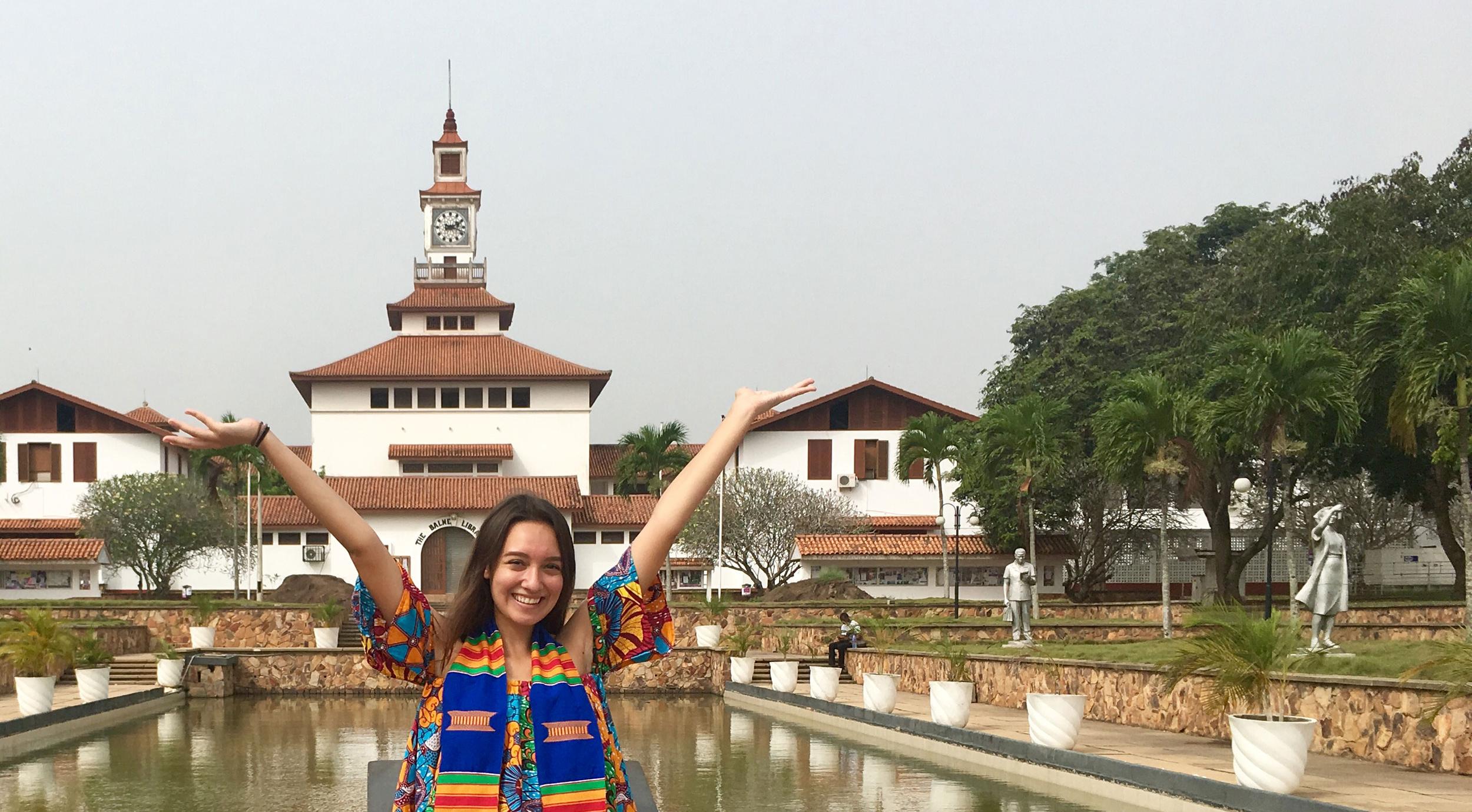 UCEAP student smiling with her arms in the air in Accra, Ghana