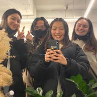 Brea Spencer and friends take a selfie together in a mirror. 